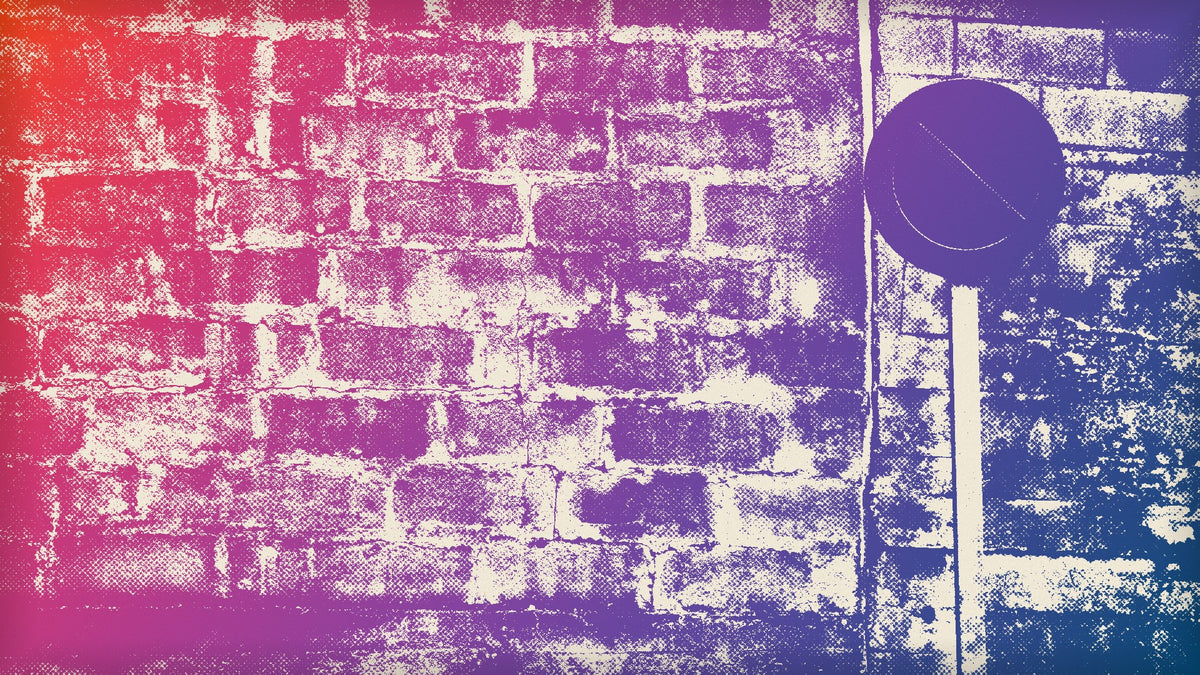 A circular prohibition sign with a diagonal slash on a metal pole against a weathered block wall, printed in a photocopy style with ink shading from orange to blue.