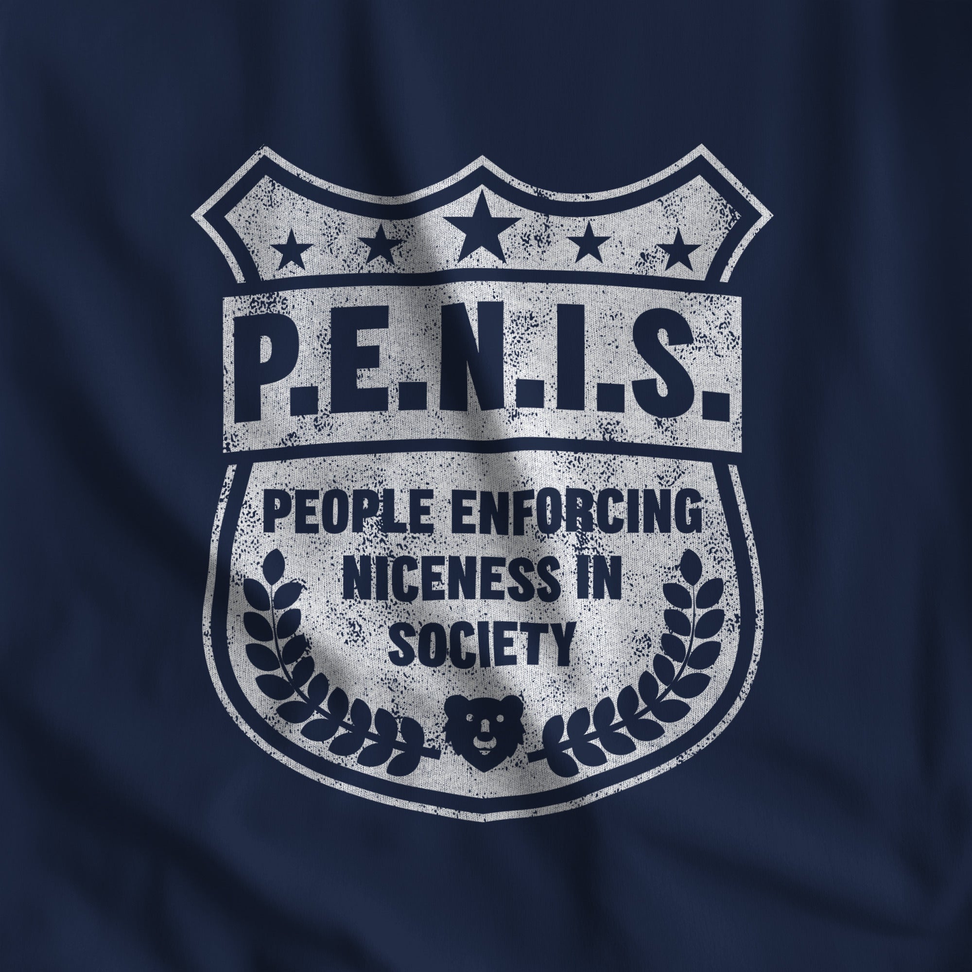 Close-up of the distressed P.E.N.I.S. police badge print with stars and laurels on navy fabric #color_Navy