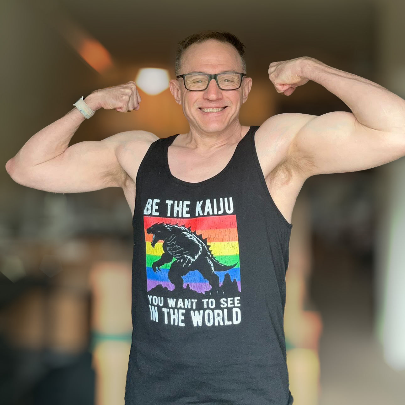 michael_d_kaiju wearing the Be The Kaiju Pride Tank Top