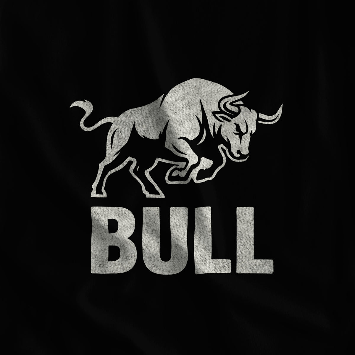 Close-up of the BULL print, a charging bull in off-white ink over block lettering on black fabric #color_Black