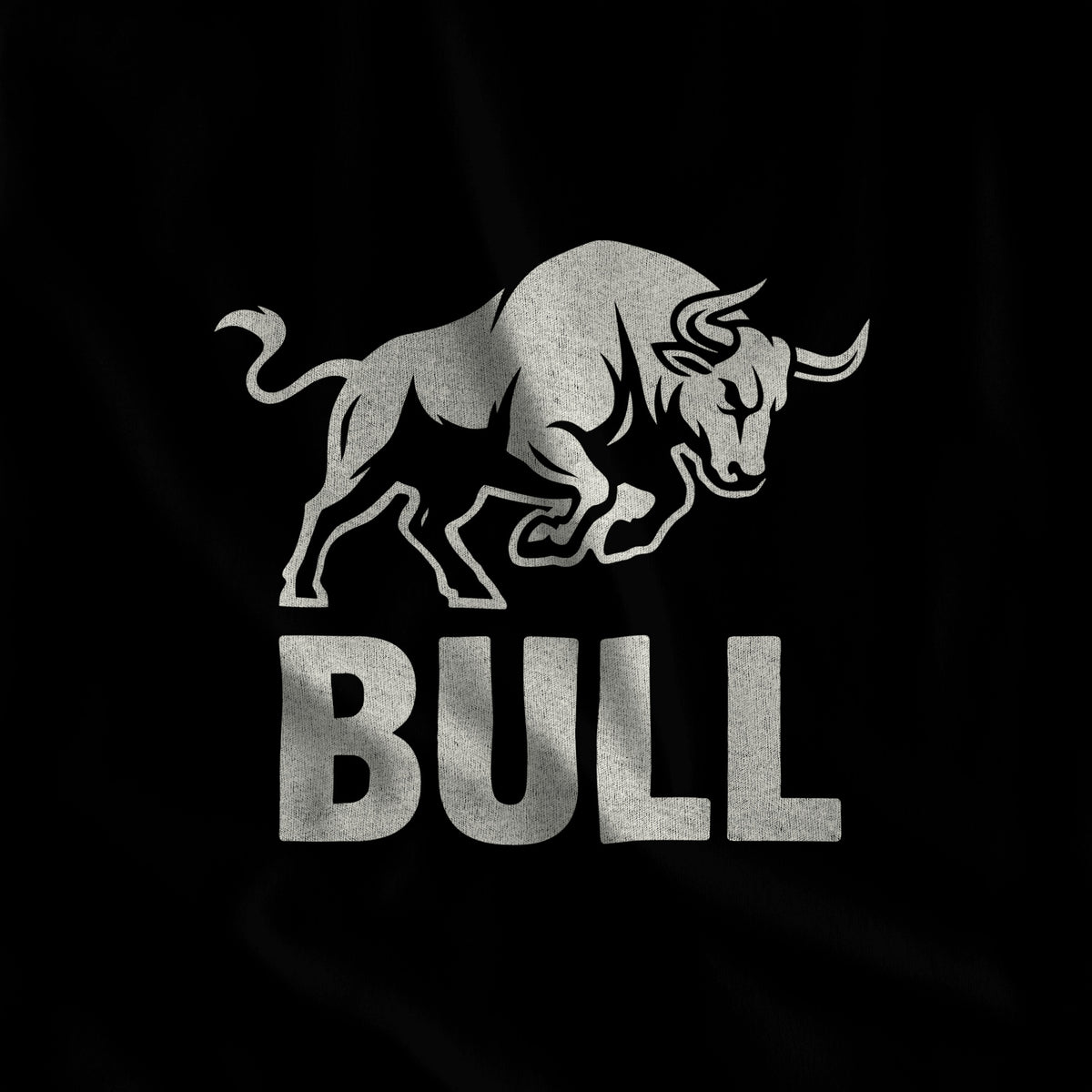 Close-up of the BULL print, a charging bull in off-white ink over block lettering on black fabric #color_Black