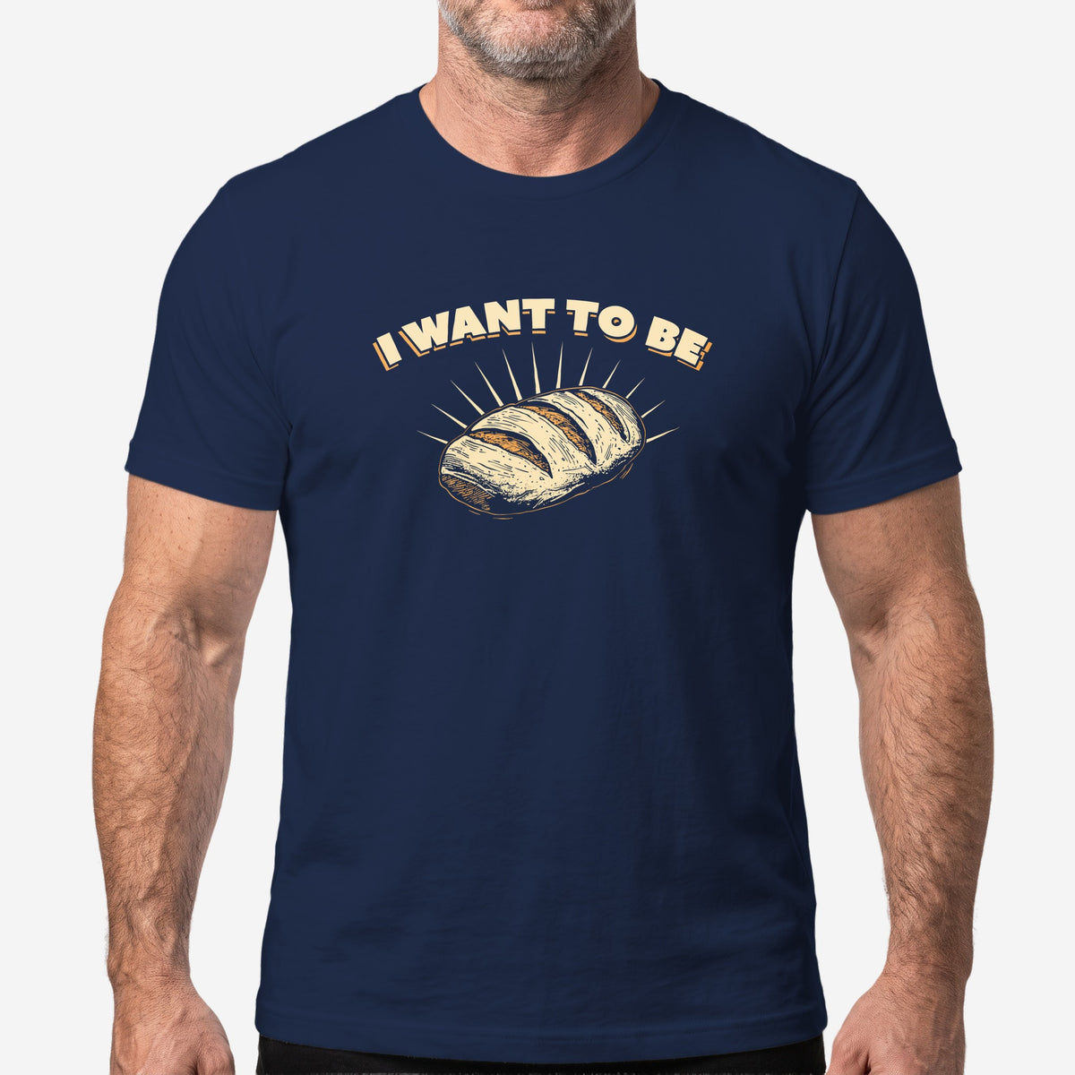 I WANT TO BE BREAD graphic on a navy t-shirt, worn on a model #color_Navy