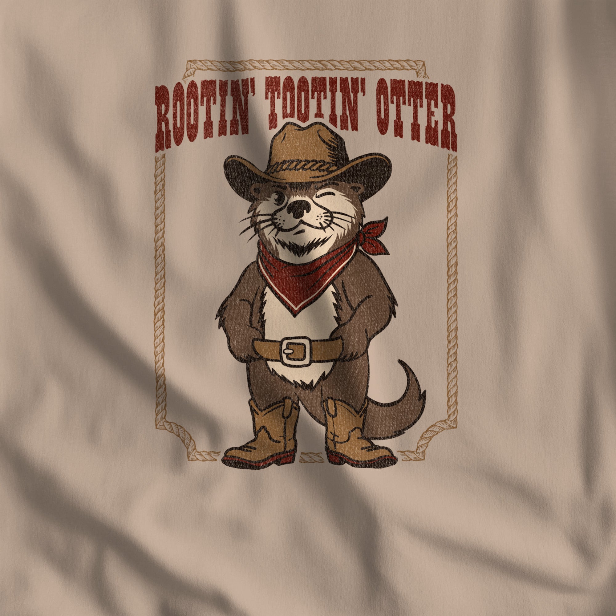 Close-up of the Rootin' Tootin' Otter western print on tan t-shirt fabric #color_Tan