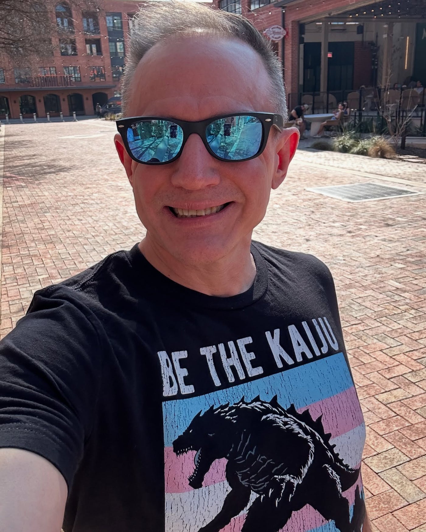 michael_d_kaiju wearing the Be The Kaiju You Want to See in the World T-Shirt (Trans Edition)